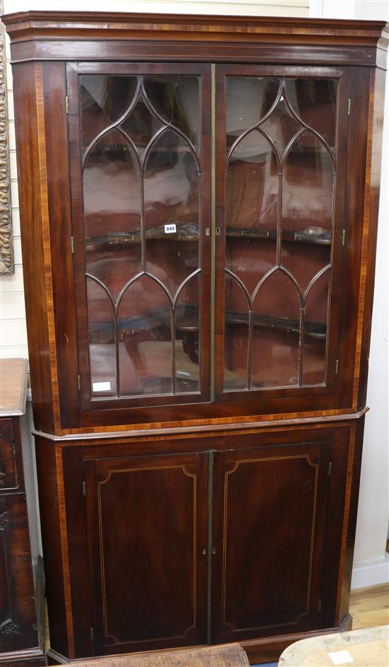 A George III inlaid mahogany corner bookcase W.110cm